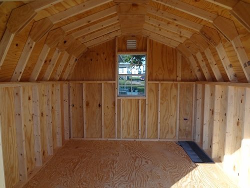 Inside top view of a Colonial Greenfield Shed by Little Cottage Company showing its wooden framing and open space.