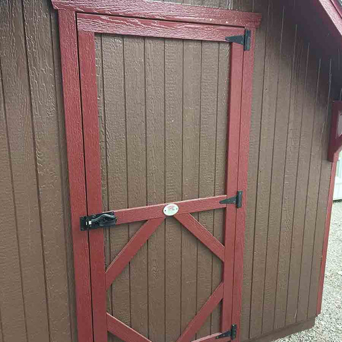 The charming door entrance to the Craftsman Playhouse with Slide by Little Cottage Company, welcoming young adventurers to explore its wonders