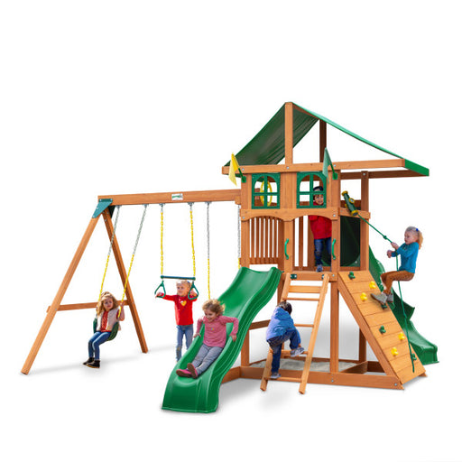 Gorilla Playsets Outing With Tube Slide Swing Set Treehouse with kids in a studio