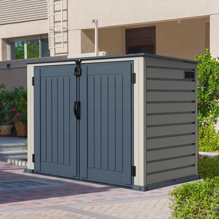 The Duramax 2100L MultiStore Outdoor Storage Box, a gray and beige weatherproof storage shed with double doors and a flat top, offers a discreet solution for storing garbage bins and outdoor equipment.