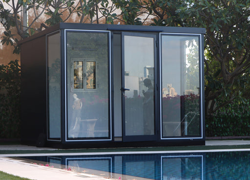 duramax garden room 10x10 empty insulated glass building front view placed by poolside
