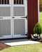 Close-Up of EZ-Fit Sheds Craftsman Storage Shed Double Doors with Red and Gray Panel Design, Surrounded by Greenery