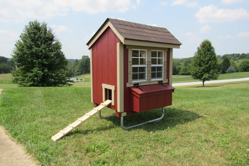 A view of the EZ-Fit Portable Chicken Coop with 3x4 dimensions, showcasing its sturdy structure and red and beige color scheme in an outdoor setting.