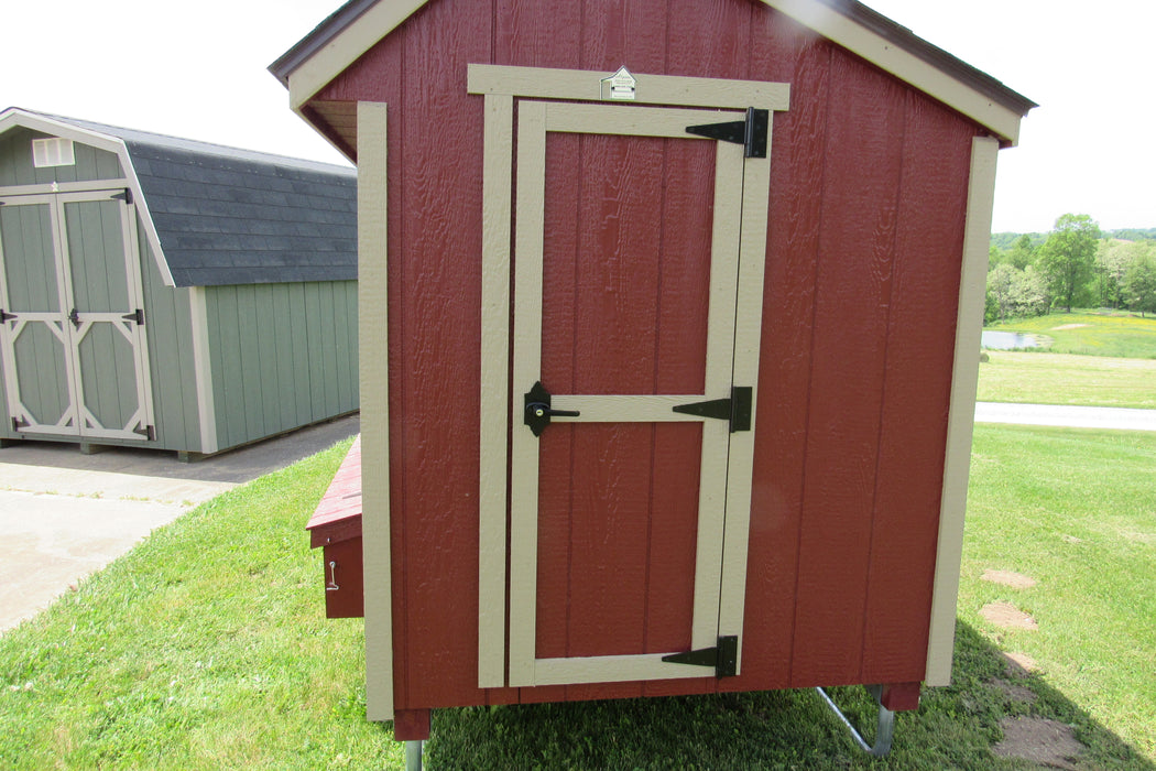 Exterior view of an EZ-Fit portable chicken coop kit measuring 5x8, featuring robust door hinges and secure locking mechanisms.