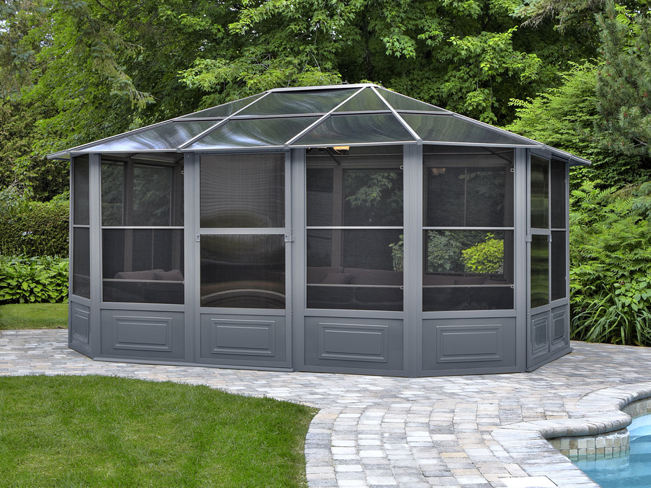 The full structure of a Florence 12x15 freestanding solarium gazebo with a slate-colored metal roof, showcasing the octagonal design and screened windows on a clear day.