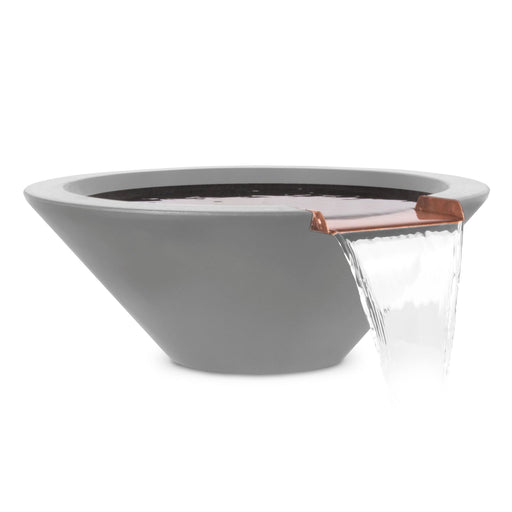 A soothing water cascade from The Outdoor Plus Round Cazo Water Bowl made of GFRC concrete in natural gray, combining the serene beauty of water with the strength of concrete