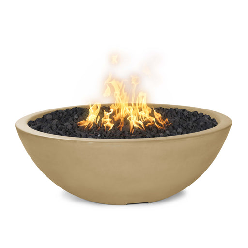 The Outdoor Plus Round Sedona Fire Pit, constructed from GFRC concrete in a rich brown shade, with lively flames creating a cozy ambiance