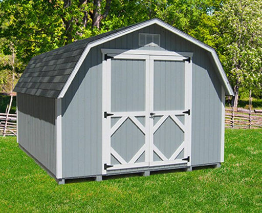 A grey gambrel barn exterior from the Little Cottage Company featuring classic double doors and 4′ sidewalls in a grassy outdoor setting.