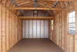 Inside view of a Colonial Greenfield Shed by Little Cottage Company showing its wooden framing and open space.