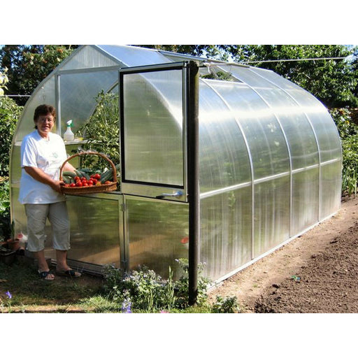 Riga Greenhouses with a person outside