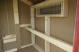 Interior view of the EZ-Fit Chicken Coop's roosting area, illustrating the ample space and wooden perches for chicken comfort.