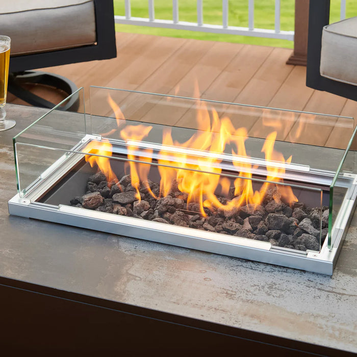 Close-up of the Fire Pit Table's flames flickering above the lava rocks.