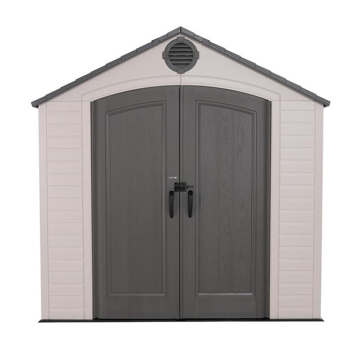 Studio front view of the Lifetime 8 ft x 5 ft Outdoor Storage Shed showing the gray doors and beige walls.
