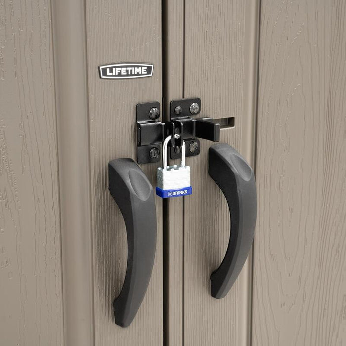 Close-up of the Lifetime shed's locking mechanism, featuring a black handle and a silver padlock for security.