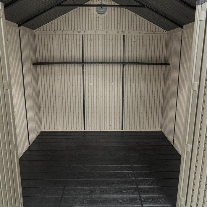 Interior view of the empty Lifetime shed, emphasizing the ample storage space and the vertical support beam.