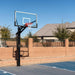 Full court view of the Lifetime 72-Inch Mammoth Bolt Down Basketball Hoop installed on an outdoor court with a clear sky in the background.
