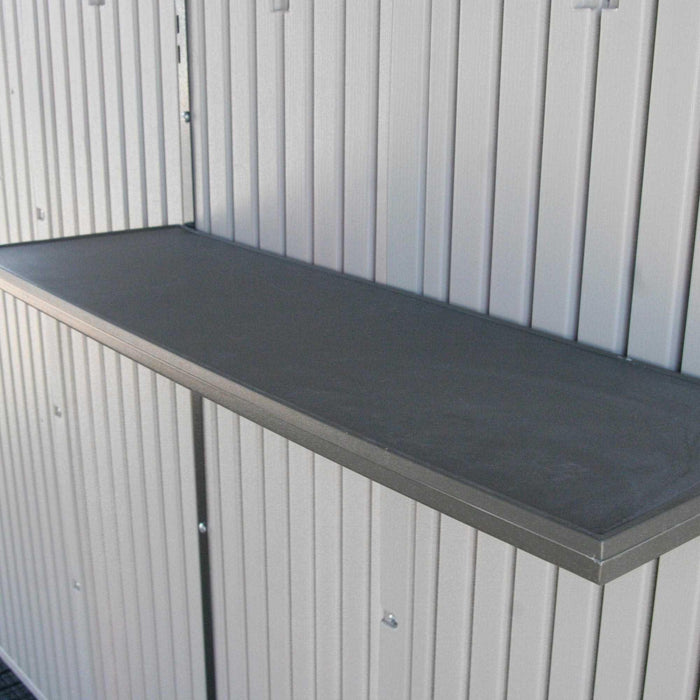 Interior view of the Lifetime Outdoor Storage Shed showing the gray shelf against the wall.