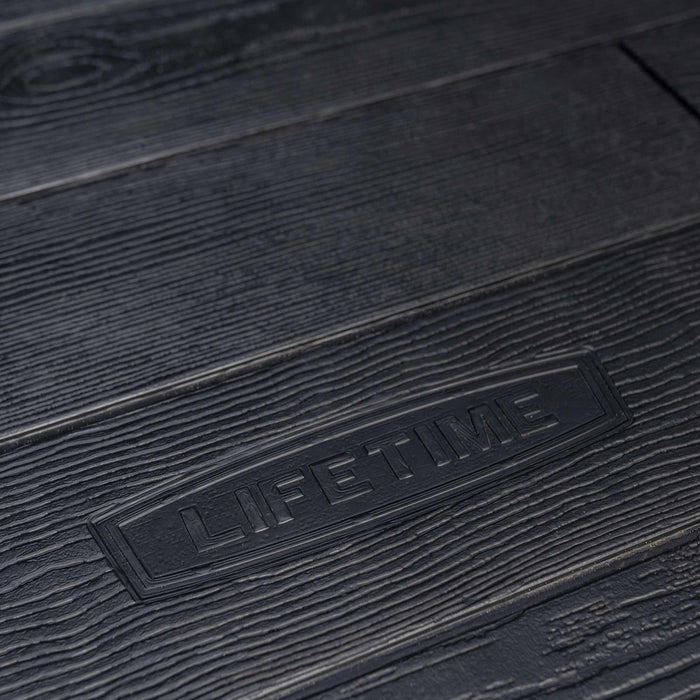 Close-up of the Lifetime logo imprinted on the textured floor of the 8 x 17.5 ft Outdoor Storage Shed.