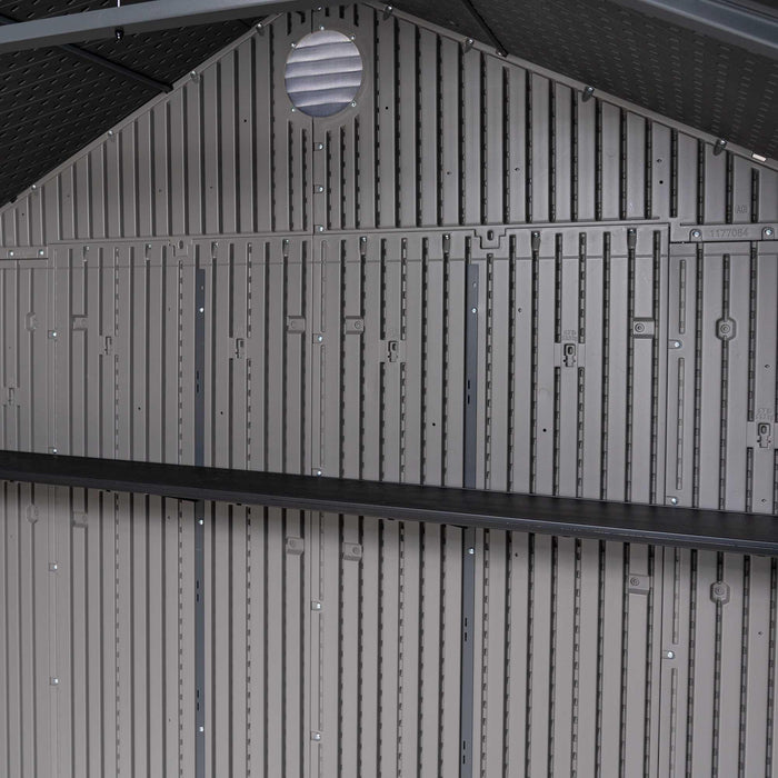  Inside view of the Lifetime 8 x 17.5 ft Outdoor Storage Shed showing the wall structure and shelving details.