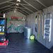 Interior of the Lifetime 8 x 17.5 ft Outdoor Storage Shed, neatly organized with garden tools and equipment.