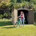 Image of a woman taking a bike out of the open Lifetime 8 x 17.5 ft Outdoor Storage Shed in a backyard setting.