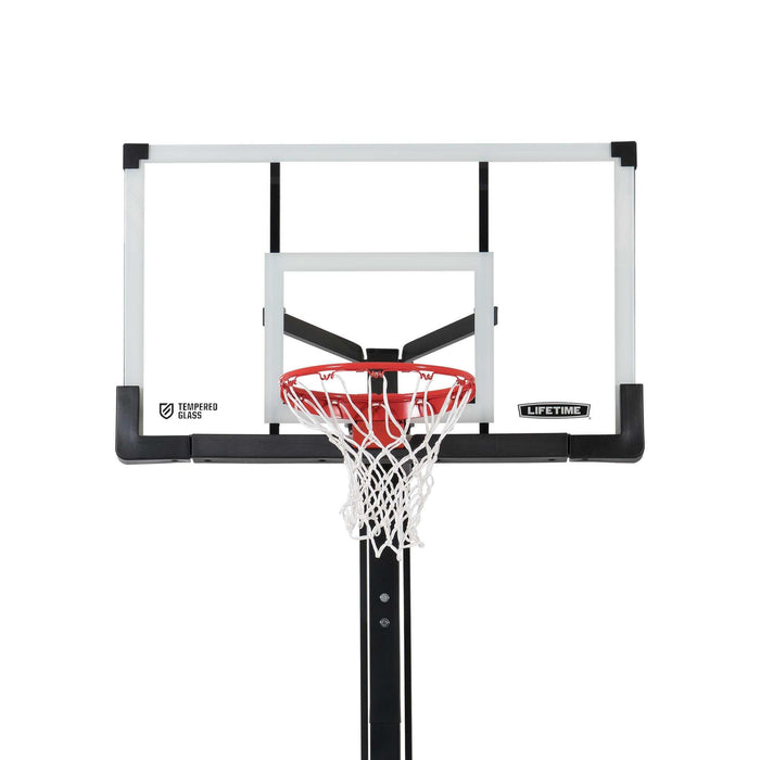 Close-up of the Lifetime Adjustable Portable Basketball Hoop's tempered glass backboard and red rim.