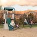 Children playing on the Lifetime Adventure Clubhouse Playset during the evening with mountains in the background.