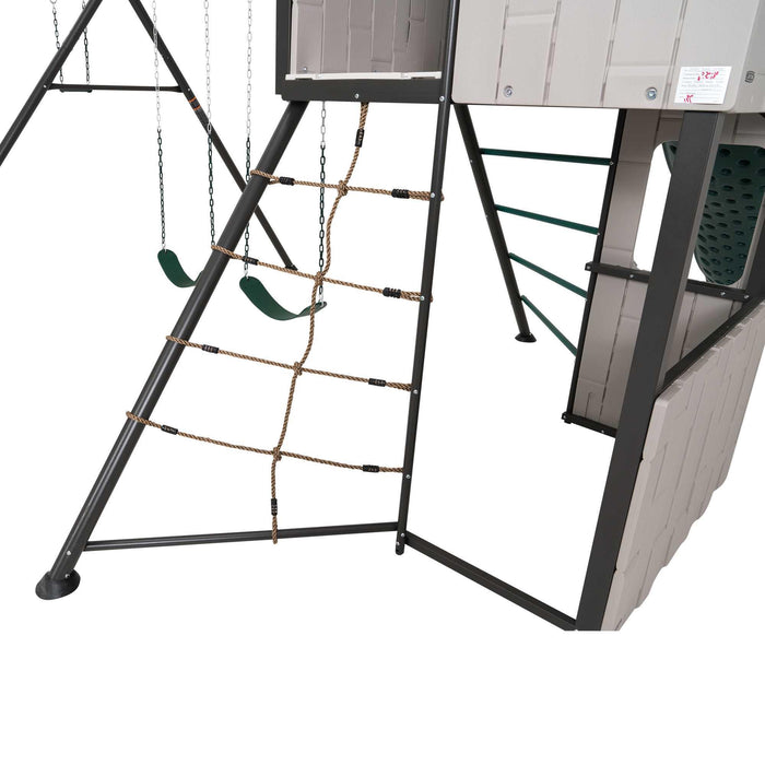 Side view of the Lifetime Adventure Clubhouse Playset, model number 91135, featuring the smooth green slide, climbing ladder with handrails, and rope cargo net for climbing, all set against a white background.