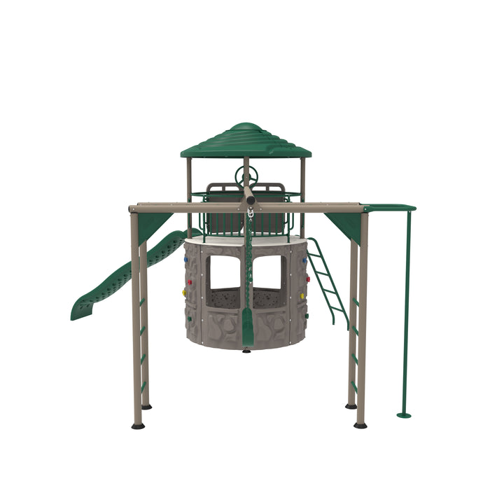 Frontal view of playset showing rock climbing wall, green slide, and tower with roof.