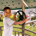 Child playing with the steering wheel feature on the Lifetime Adventure Tower Playset, SKU 91200.