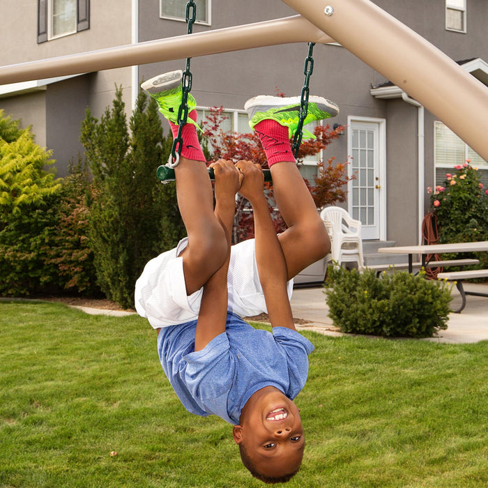 Child hanging upside down from a swing attached to the Lifetime Adventure Tower Playset, SKU 91200.