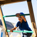 A child smiling while climbing the ladder of the Lifetime Big Stuff Deluxe Swing Set Playset.