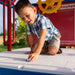 Child engaging with the car map play feature on the roof of the Lifetime Big Stuff Deluxe Swing Set, SKU 91087.