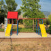 Empty Lifetime Big Stuff Deluxe Swing Set featuring slides, swings, and climbing walls in a serene park with mountains in the background.