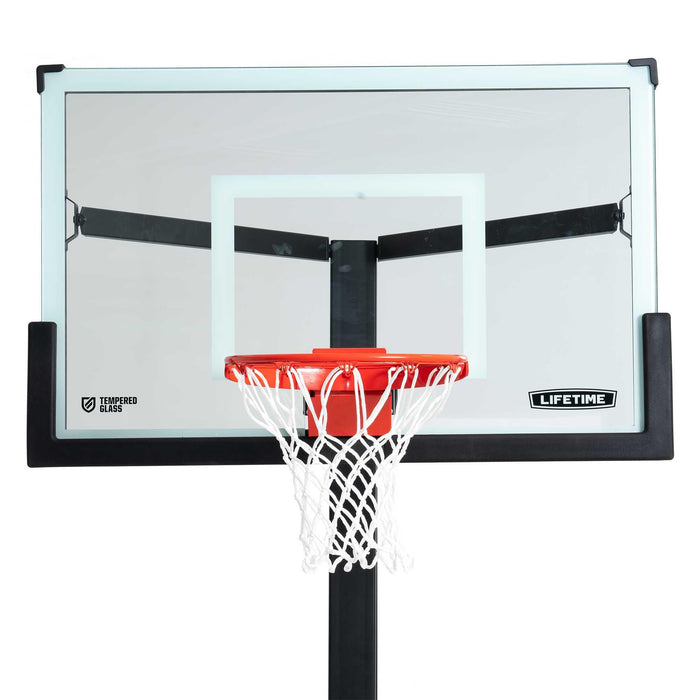 Close-up of the Lifetime Mammoth Basketball Hoop backboard with focus on the tempered glass and hoop.