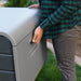 Close-up of the integrated side handle on the Lifetime Modern Outdoor Storage Deck Box, emphasizing the ergonomic design.