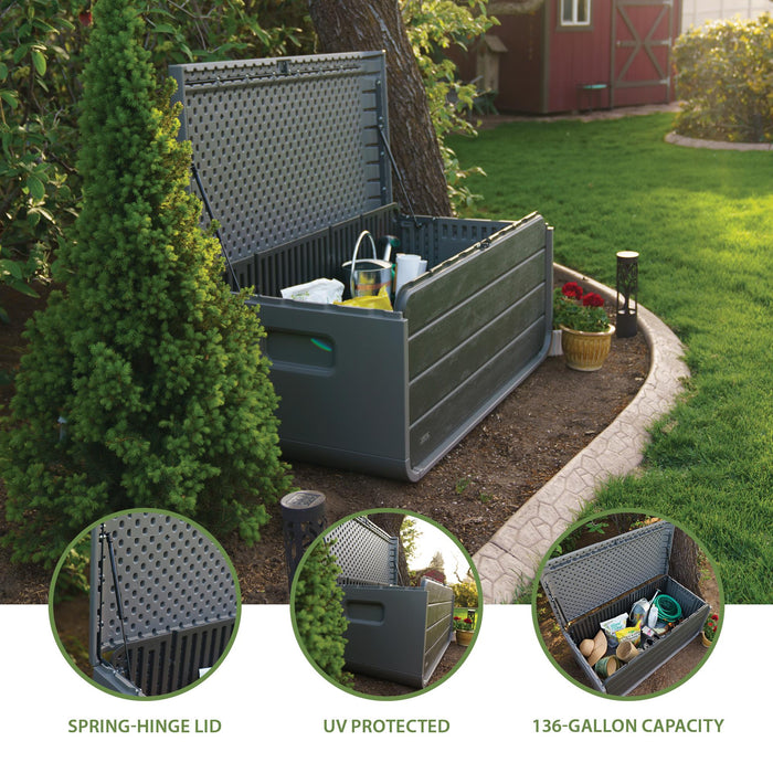 The Lifetime Modern Outdoor Storage Deck Box filled with gardening supplies, illustrating the 136-gallon storage capacity.