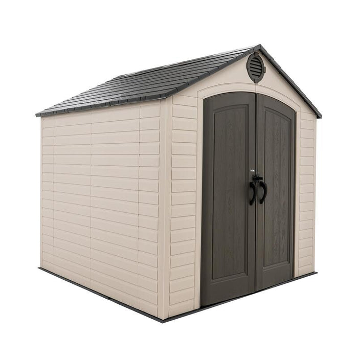 Side perspective of the beige and dark-trimmed Lifetime 8 ft x 7.5 ft Outdoor Storage Shed, closed doors.