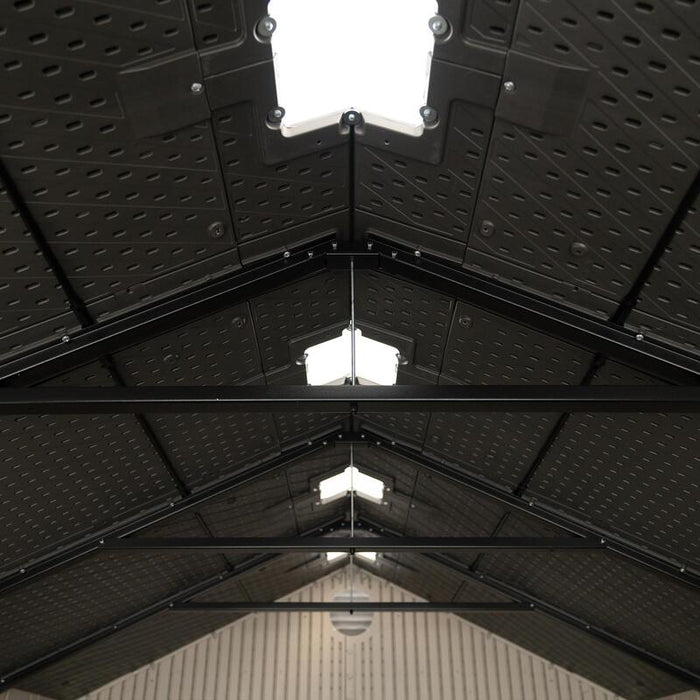 Interior view of the roof structure of the Lifetime 8 ft x 12.5 ft Outdoor Storage Shed, with a skylight visible.