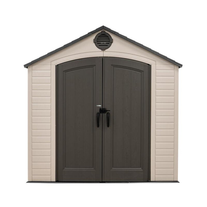Frontal view of the closed Lifetime 8 ft x 7.5 ft Outdoor Storage Shed in beige with dark doors and a vent on the gable.