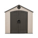 Frontal view of the closed Lifetime 8 ft x 7.5 ft Outdoor Storage Shed in beige with dark doors and a vent on the gable.