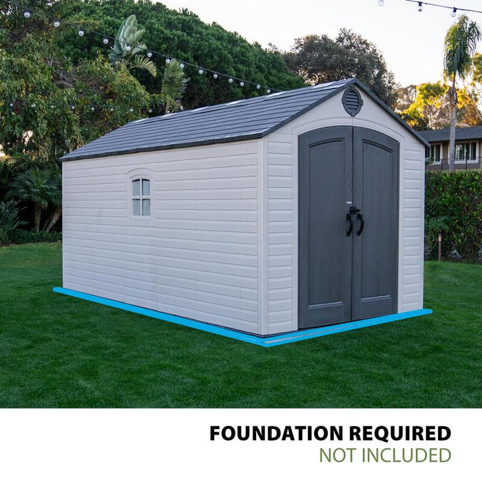 Lifetime storage shed on grass showcasing the blue outline where a foundation is required for installation, not included with the shed.