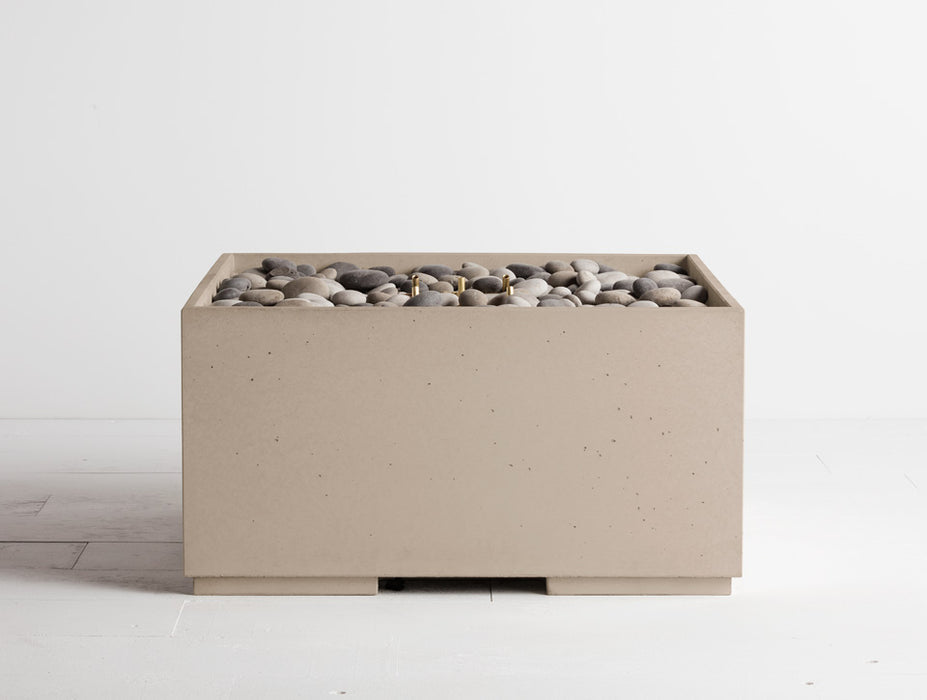Linen white Solus Decor Firebox 30 displaying a clean-lined, box-shaped design contrasted with dark grey stones, ideal for modern patio decor.