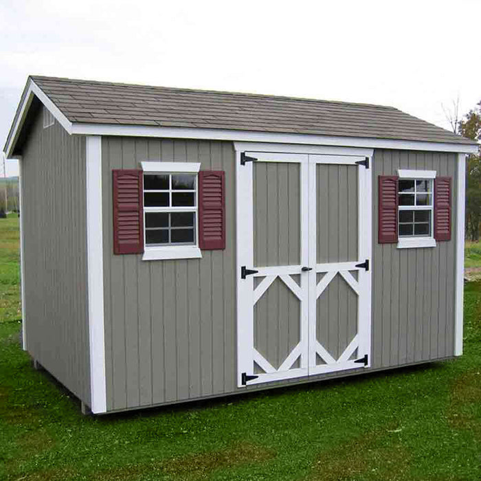 Grassy field with a grey-colored Workshop Value Shed with Floor Kit.