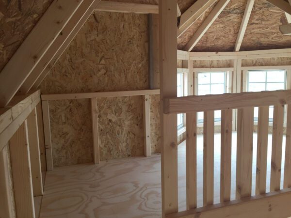 The loft inside Sara's Victorian Mansion Playhouse by  Little Cottage Company.