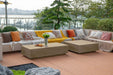 Elementi Colorado Series Sunlight yellow rectangle coffee table elegantly placed in an outdoor seating area overlooking a marina, complemented by colorful cushions.