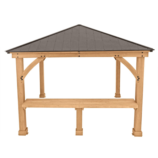 A minimalist wooden gazebo by Yardistry Meridian featuring an integrated bar counter, showcasing the structure's potential for entertainment and social gatherings, with a sturdy metal roof overhead.