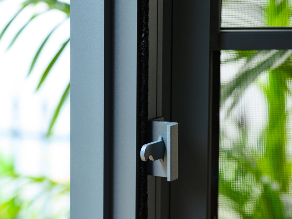 Detailed view of the door latch on the Metal gazebo, showcasing the hardware's design and color matching with the structure.