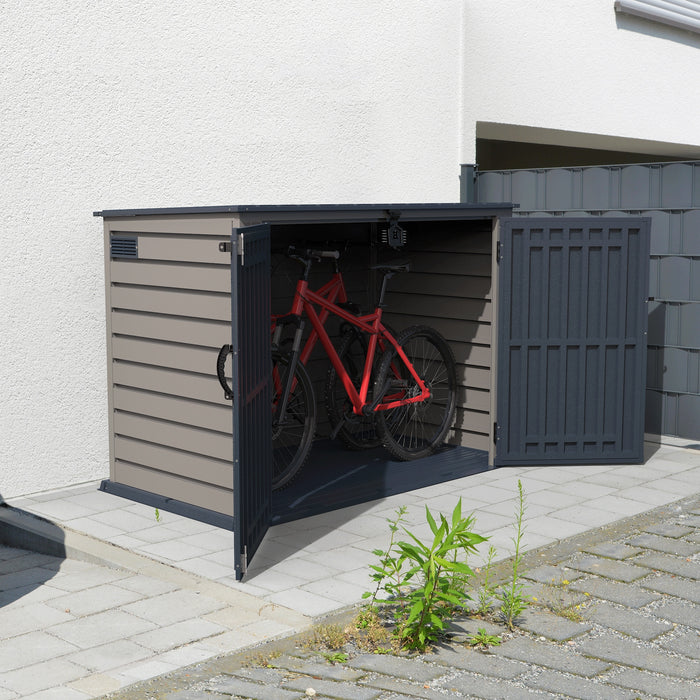 The Duramax 2100L MultiStore Outdoor Storage Box, with its double doors open, reveals ample storage space for two bicycles.