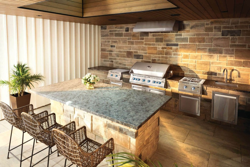A well-appointed outdoor kitchen featuring the Napoleon Grills Built-In 700 Series 44-Inch RB 8-Burner Gas Grill Head, emphasizing the professional design and functionality.